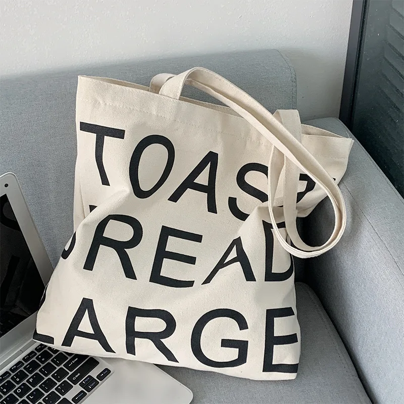 Letter shopping bag white canvas bag women's single shoulder large-capacity college style women's shoulder Japanese shopping bag
Letter shopping bag white canvas bag women's single shoulder large-capacity college style women's shoulder Japanese shopping bag