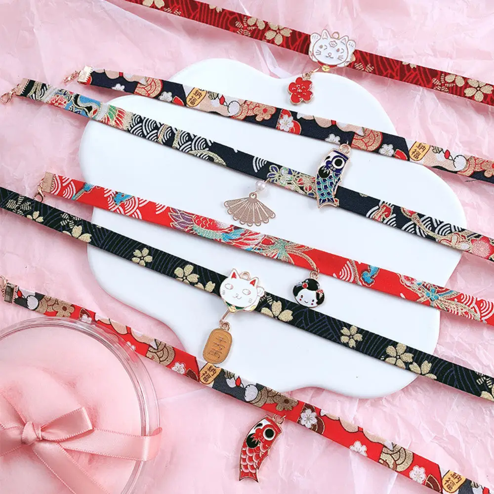 New Classic Japanese Style Ribbon Rope Doll Choker Cute Romantic Women Girls Bird Cat Carp Pendant Short Necklace Jewelry
New Classic Japanese Style Ribbon Rope Doll Choker Cute Romantic Women Girls Bird Cat Carp Pendant Short Necklace Jewelry