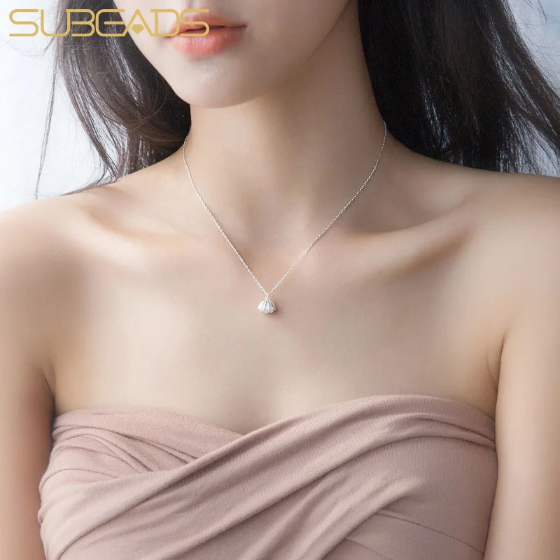 Ожерелье Subeads с жемчужной подвеской, женское посеребренное ожерелье-цепочка, чокер на шею, модная летняя бижутерия, подарок
Ожерелье Subeads с жемчужной подвеской, женское посеребренное ожерелье-цепочка, чокер на шею, модная летняя бижутерия, подарок