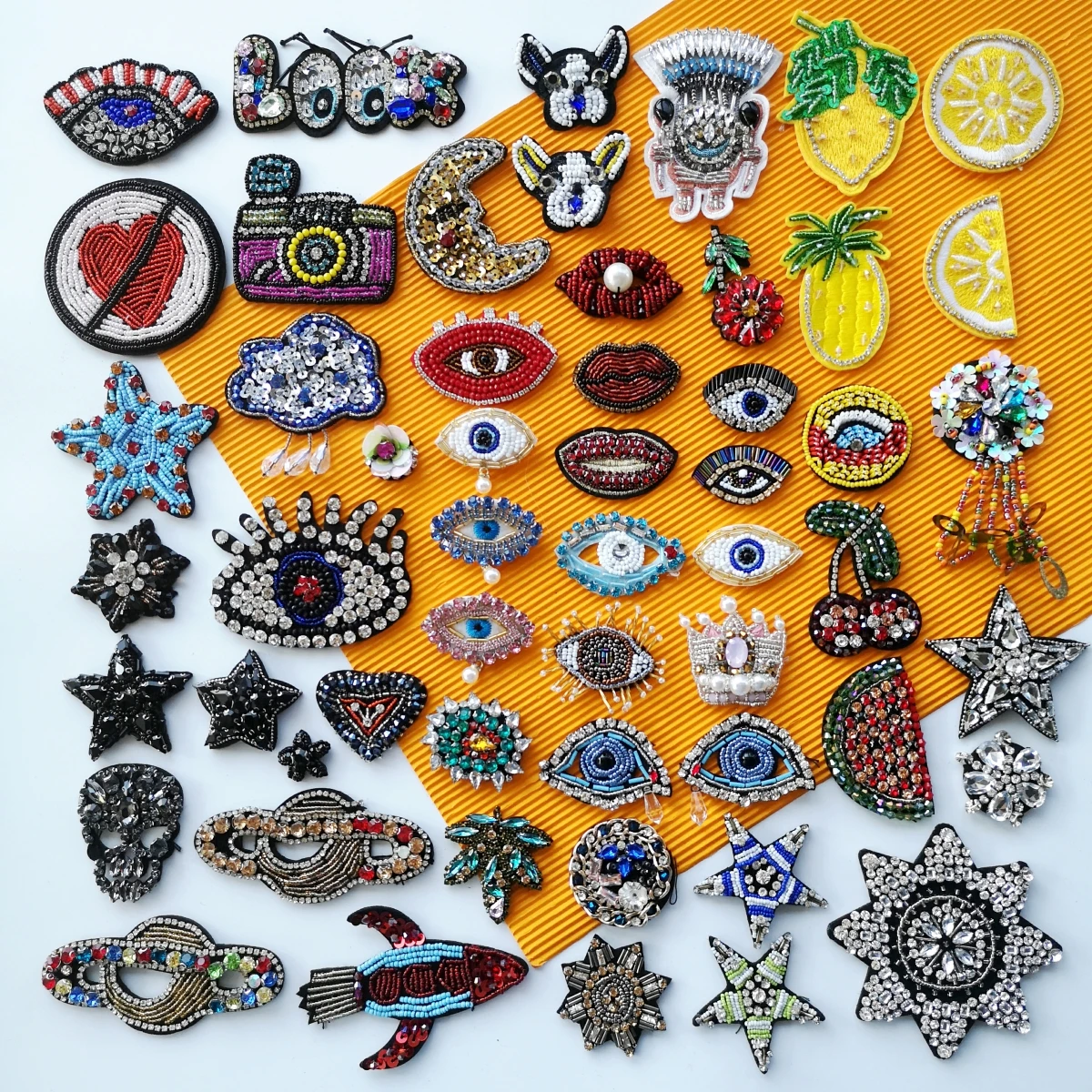 embroidery beaded eye patch,embroidered eyes patches,star appliques,heart badges,earth crown watermelon badge SK-19051813
embroidery beaded eye patch,embroidered eyes patches,star appliques,heart badges,earth crown watermelon badge SK-19051813