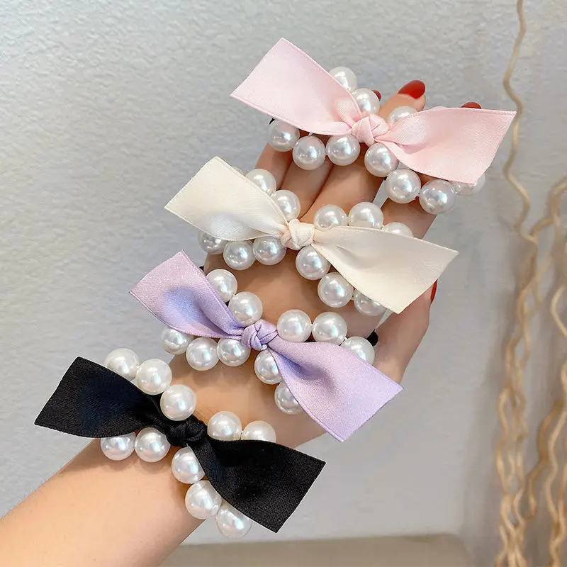 New Style small fragrance sweet maiden fairy pearl bow black hair ring temperament hair rope retro elegant hair rope
New Style small fragrance sweet maiden fairy pearl bow black hair ring temperament hair rope retro elegant hair rope