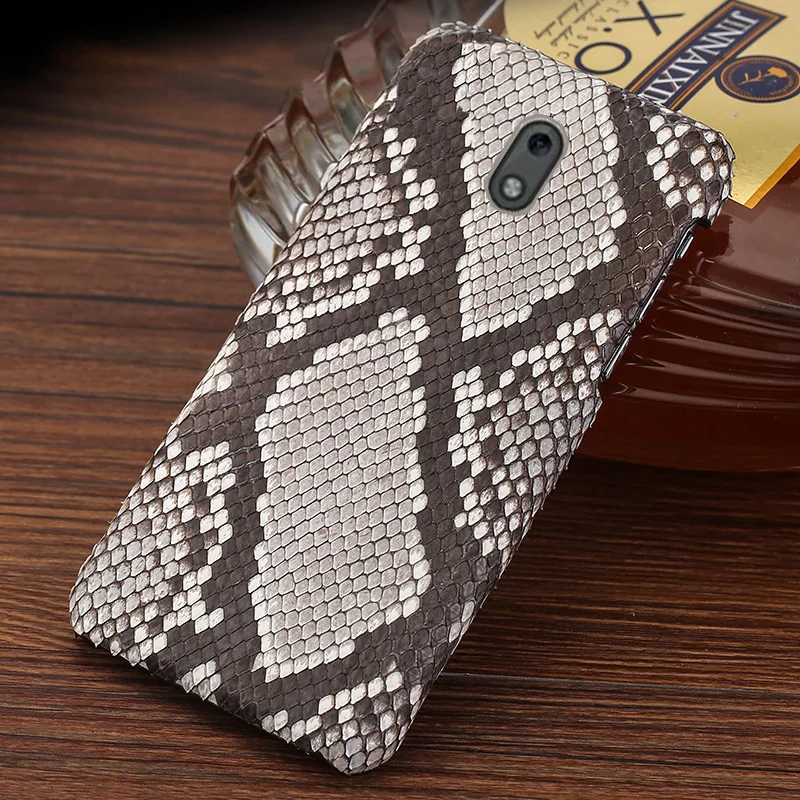 Suitable for Nokia 2 mobile phone case Nokia 8.3 genuine leather half-pack natural python leather protective cover 
Suitable for Nokia 2 mobile phone case Nokia 8.3 genuine leather half-pack natural python leather protective cover