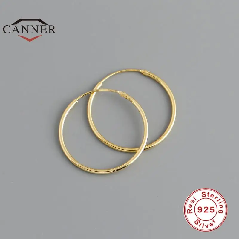 CANNER 925 Sterling Silver Fashion Korean Simple Circle Piercing Hoop Earrings for Women Men Charming Party Jewelry Accessories
CANNER 925 Sterling Silver Fashion Korean Simple Circle Piercing Hoop Earrings for Women Men Charming Party Jewelry Accessories