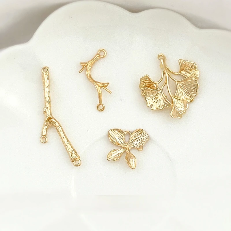 Copper plated 18K true gold Ginkgo four-leaf flower porous branch DIY earring necklace jewelry material
Copper plated 18K true gold Ginkgo four-leaf flower porous branch DIY earring necklace jewelry material