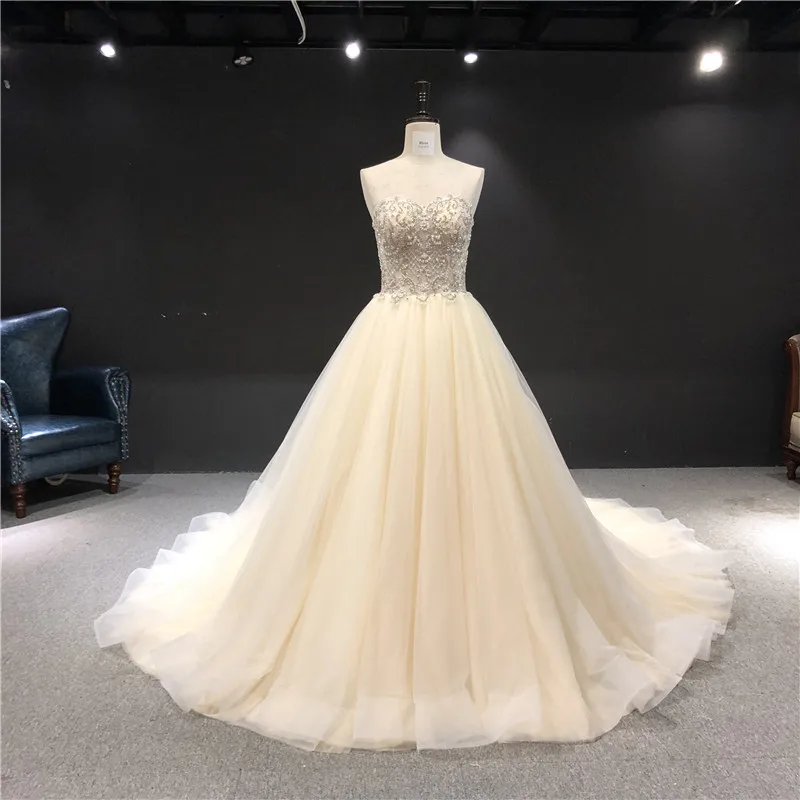100%Real Photos Champagne Color vestidos de novia Sweatheart Ball Gown Heavy Beadings Big Train Floor Length Wedding Dress
100%Real Photos Champagne Color vestidos de novia Sweatheart Ball Gown Heavy Beadings Big Train Floor Length Wedding Dress