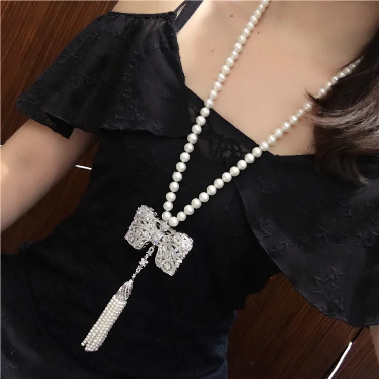 Hot sell new style 9-10mm white freshwater pearl necklace bowknot zircon accessories long tassel sweater chain fashion jewelry
Hot sell new style 9-10mm white freshwater pearl necklace bowknot zircon accessories long tassel sweater chain fashion jewelry