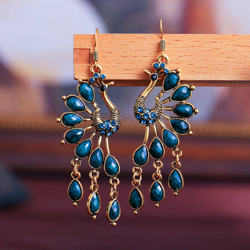 Vintage Women's Peacock Shape Indian Jhumka Earrings Turkish Blue Stone Beads Carved Alloy Dangle Earrings Gypsy Tribal Jewelry
Vintage Women's Peacock Shape Indian Jhumka Earrings Turkish Blue Stone Beads Carved Alloy Dangle Earrings Gypsy Tribal Jewelry