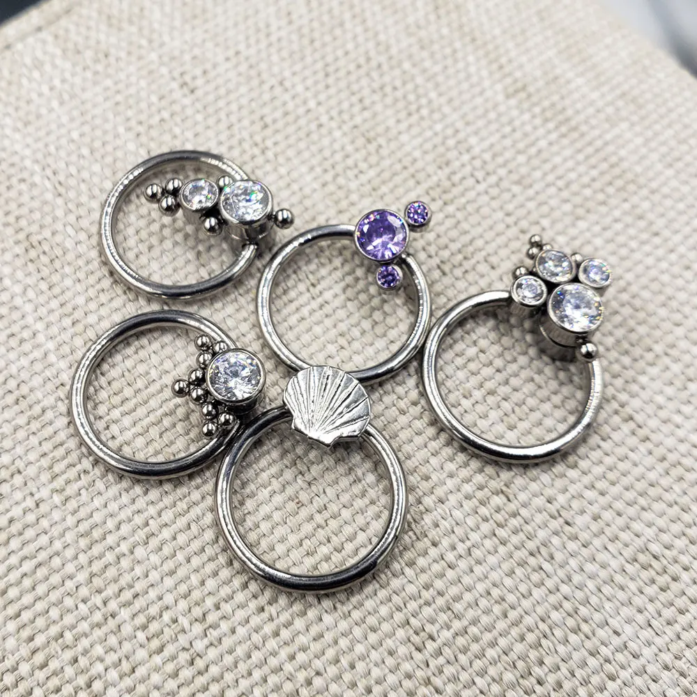 16G Implant Grade ASTM F136 Titanium Captive Bead Ring CZ Earrings Body Jewelry for Septum Daith Cartilage Conch Piercings
16G Implant Grade ASTM F136 Titanium Captive Bead Ring CZ Earrings Body Jewelry for Septum Daith Cartilage Conch Piercings