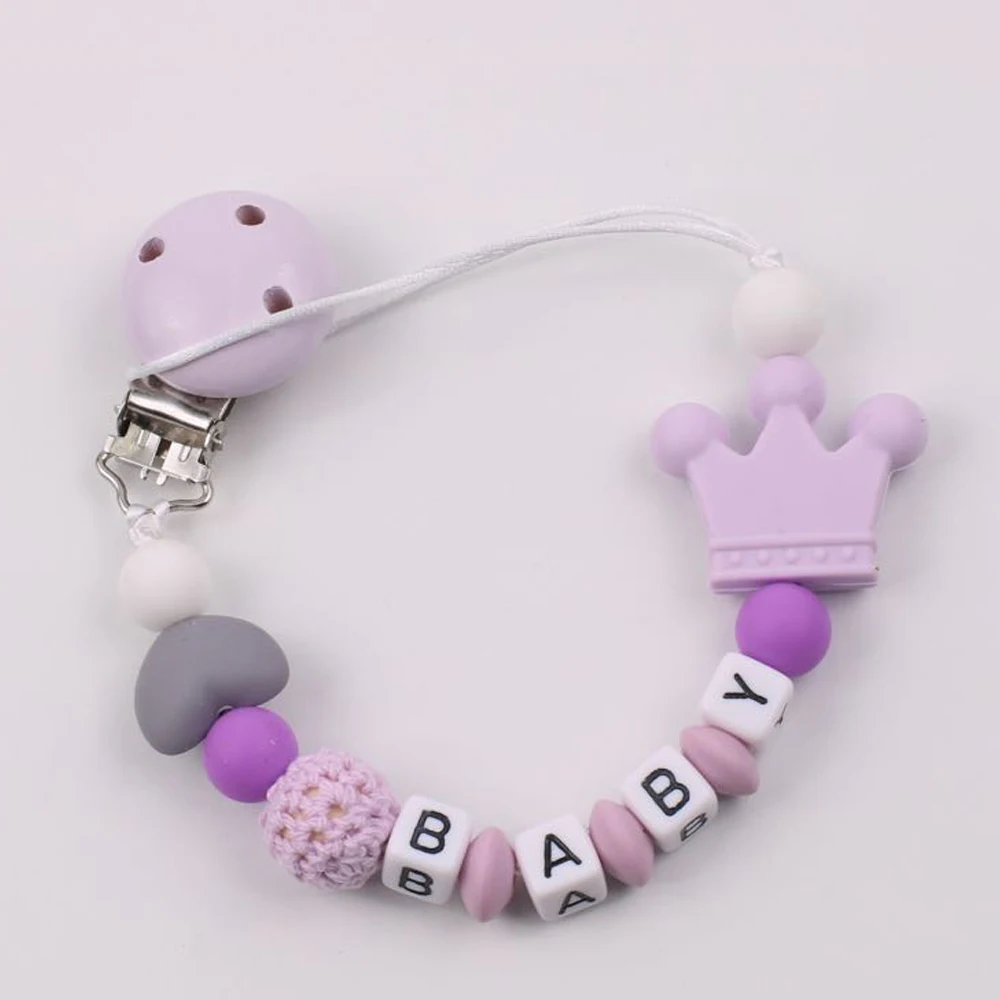 Personalized wooden hand-pacified nipple holding someone's letter crown silicone beads baby teether tooth chain
Personalized wooden hand-pacified nipple holding someone's letter crown silicone beads baby teether tooth chain