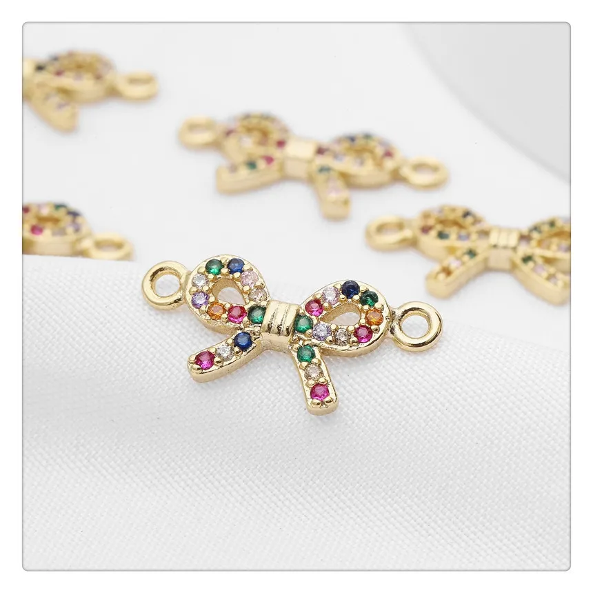 14K copper clad gold color protection and six color zircon bow shaped pendant is used for DIY, necklaces, earrings, accessories,
14K copper clad gold color protection and six color zircon bow shaped pendant is used for DIY, necklaces, earrings, accessories,