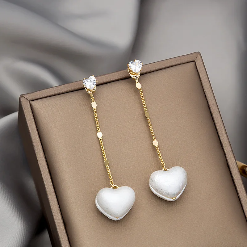 Korean Peach Heart Pearl Tassel 925 Silver Needle Earrings, Small and Fresh Temperament, Two Zircon Long, Thin Earrings Jewelry
Korean Peach Heart Pearl Tassel 925 Silver Needle Earrings, Small and Fresh Temperament, Two Zircon Long, Thin Earrings Jewelry
