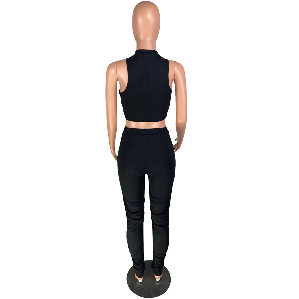 2020 new casual solid color slim movement two-piece fashion O-neck sleeveless vest and trousers women's suit 
2020 new casual solid color slim movement two-piece fashion O-neck sleeveless vest and trousers women's suit