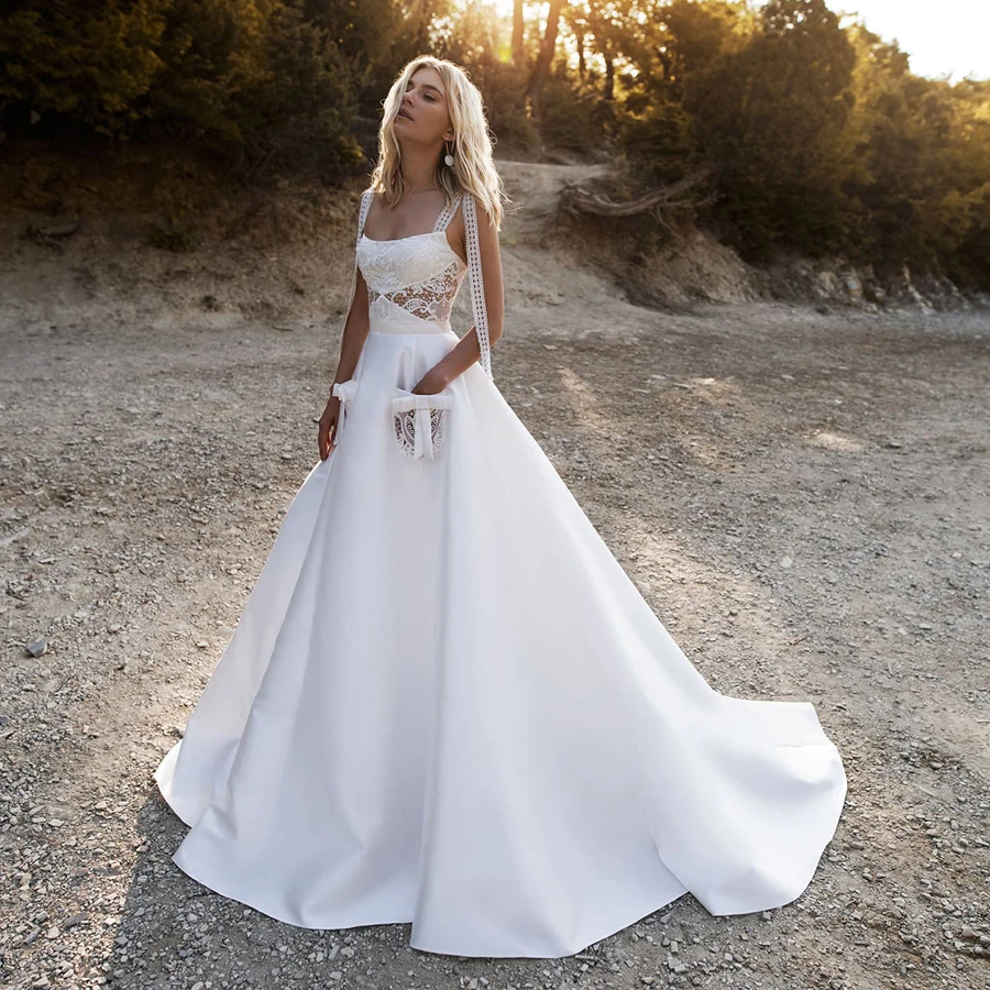Lace Spaghetti Straps See Through Cutout Ball Gown Matte Satin Wedding Dress with Lace Pocket Bohemian Bridal Dresses
Lace Spaghetti Straps See Through Cutout Ball Gown Matte Satin Wedding Dress with Lace Pocket Bohemian Bridal Dresses