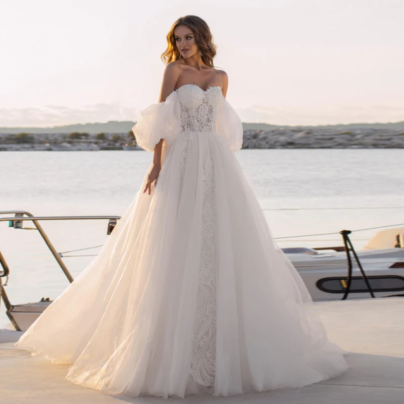 Morden Off Shoulder Sweetheart A Line Wedding Dresses Bohemian Boho Outdoor Appliques Tulle Sweep Train Beach Bridal Gowns
Morden Off Shoulder Sweetheart A Line Wedding Dresses Bohemian Boho Outdoor Appliques Tulle Sweep Train Beach Bridal Gowns