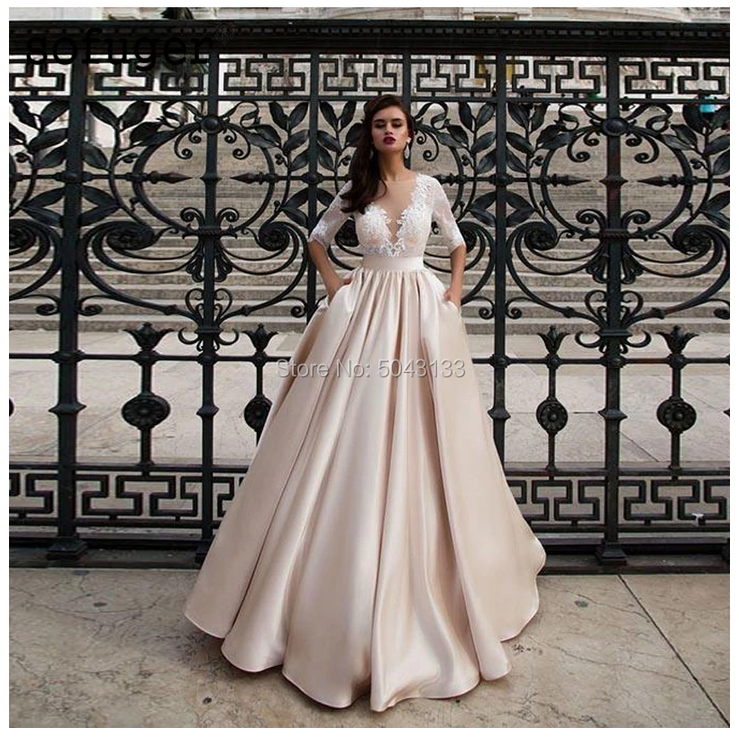 Illusion Deep V neck Satin Wedding Dresses With Pocket Vestido de Noiva Lace Half Sleeve Floor Length Champagne Bride Dress
Illusion Deep V neck Satin Wedding Dresses With Pocket Vestido de Noiva Lace Half Sleeve Floor Length Champagne Bride Dress