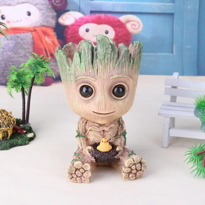 Groot Planter Pot Baby Flowerpot Action Figures Toy Pen Pot PVC Hero Model Crafts Figurine Pots for Flowers Home Decor
Groot Planter Pot Baby Flowerpot Action Figures Toy Pen Pot PVC Hero Model Crafts Figurine Pots for Flowers Home Decor