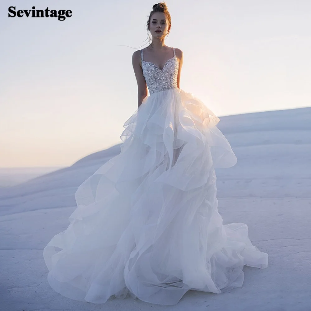 Sparkly Beaded Pearls Beach Bride Dress Tiered Tulle Boho Bride Gowns Spaghetti Straps Backless Princess Wedding Party Dress
Sparkly Beaded Pearls Beach Bride Dress Tiered Tulle Boho Bride Gowns Spaghetti Straps Backless Princess Wedding Party Dress