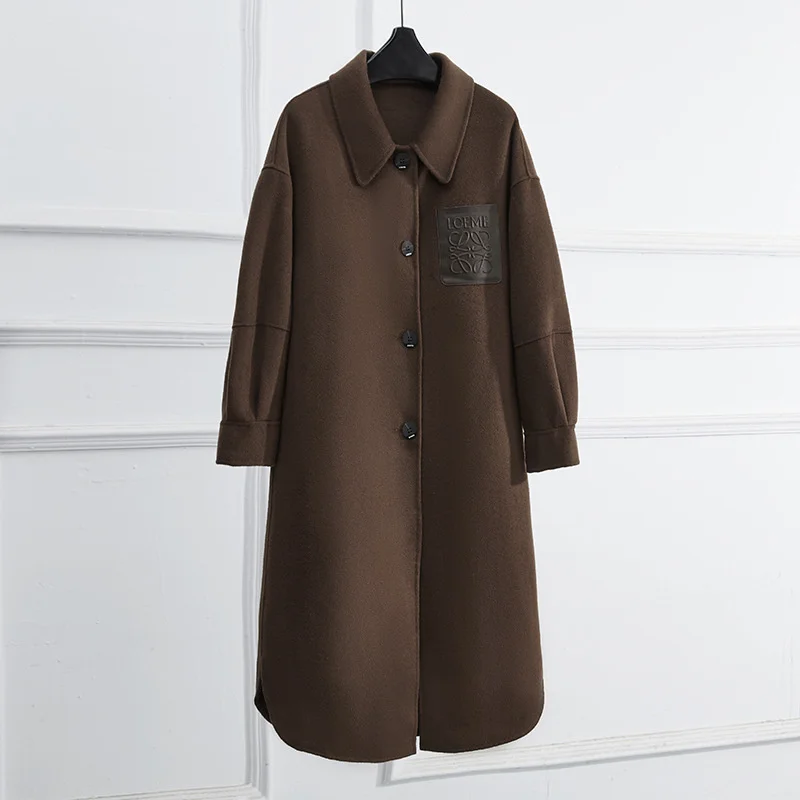 

Высококачественное шерстяное двухстороннее кашемировое пальто в новом стиле для осени и зимы, женская модная темпераментная прямая кашеми...
