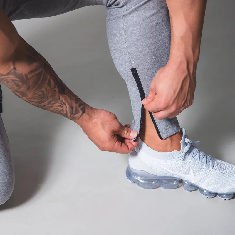 2021 brand gyms Pants Men Sweatpants Running Pants Men Joggers Cotton Trackpants Slim Fit Pants Bodybuilding Sports trousers
2021 brand gyms Pants Men Sweatpants Running Pants Men Joggers Cotton Trackpants Slim Fit Pants Bodybuilding Sports trousers