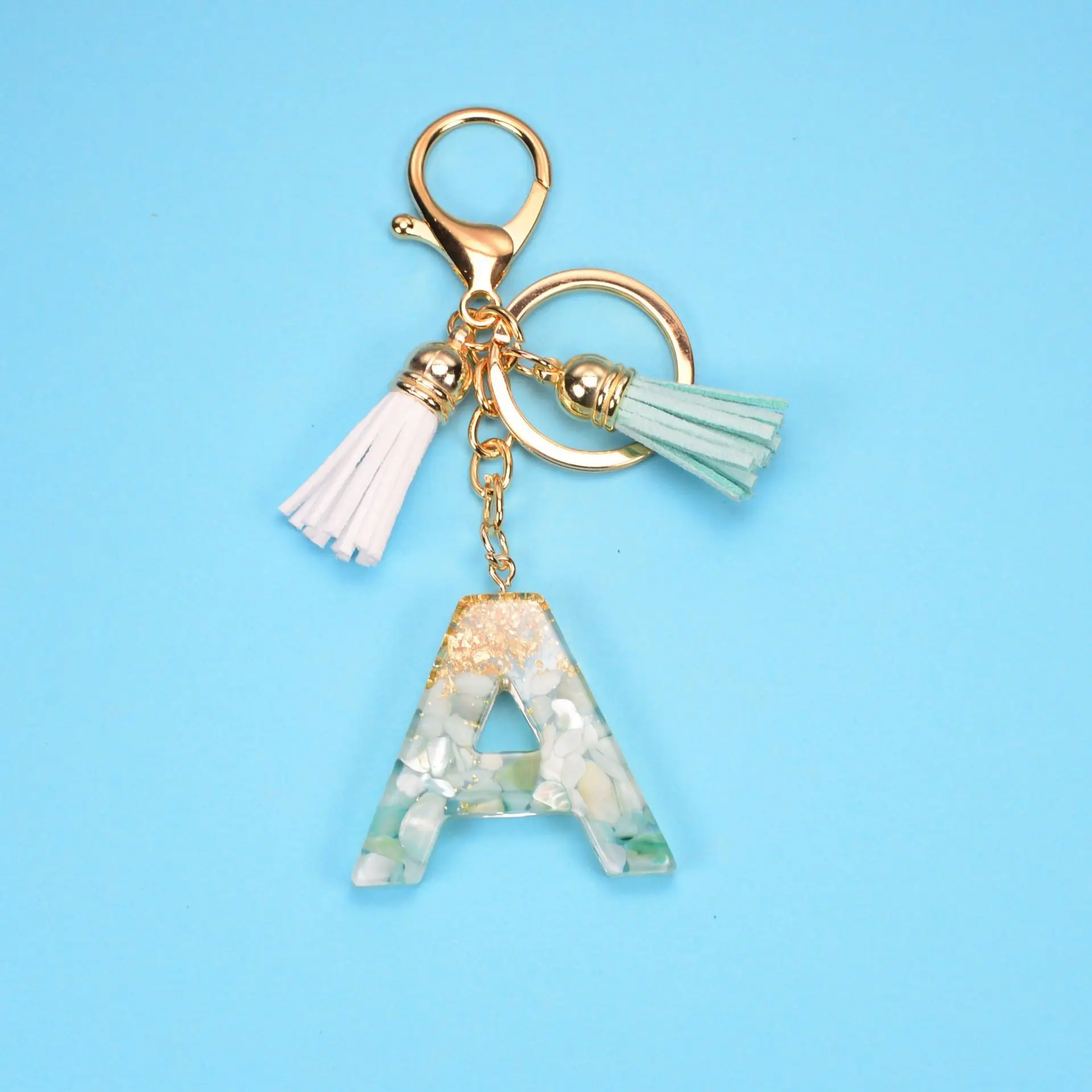 New Exquisite 26 Letters Resin Keychains Charms For Women Gold Foil Handbag Ornaments Accessories Tassel Key Rings Wholesale
New Exquisite 26 Letters Resin Keychains Charms For Women Gold Foil Handbag Ornaments Accessories Tassel Key Rings Wholesale