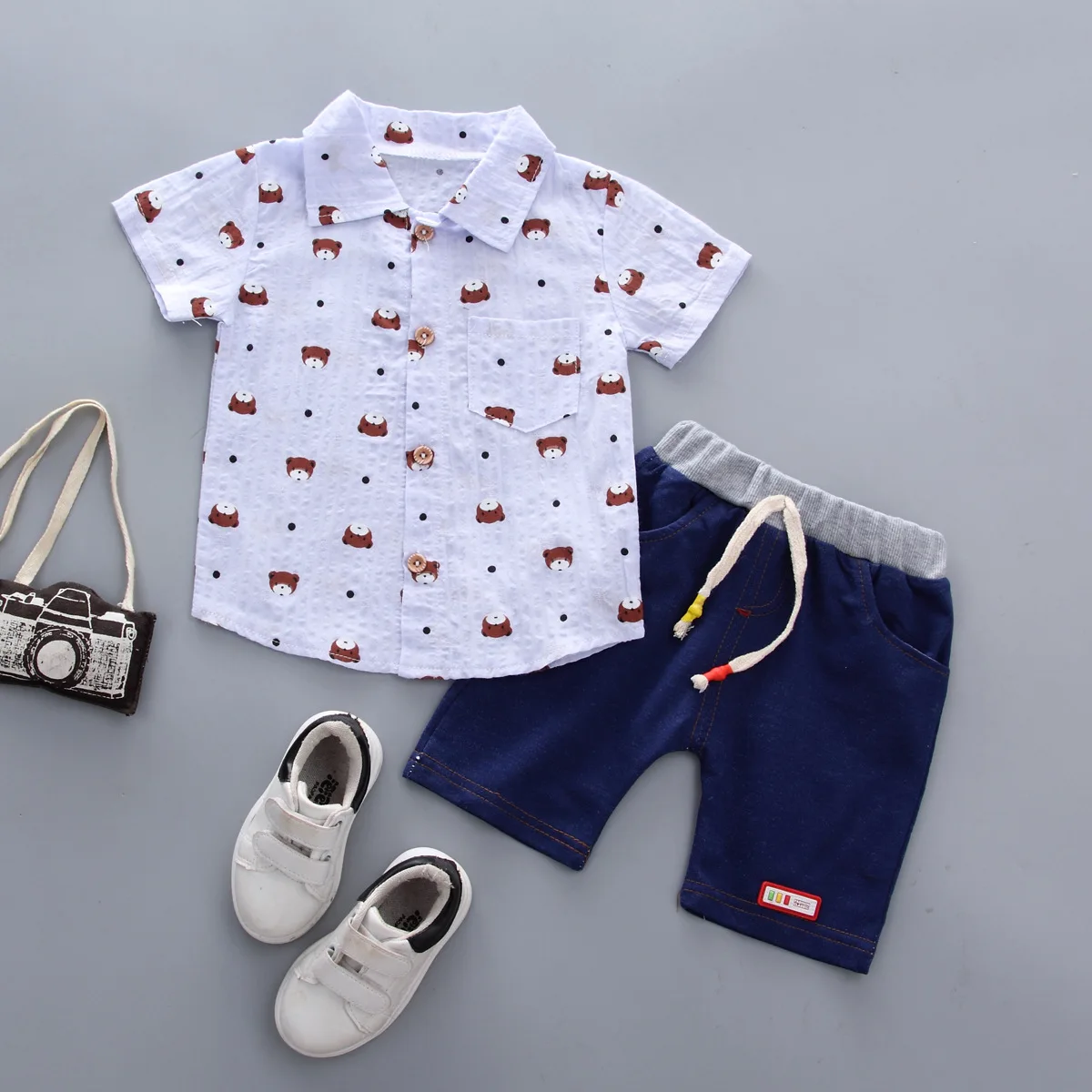 Fashion Baby Boy Clothes Summer Short-Sleeved Shorts Single Breasted Shirt Set Cartoon Bear Print Cotton Baby Two-Piece Suit
Fashion Baby Boy Clothes Summer Short-Sleeved Shorts Single Breasted Shirt Set Cartoon Bear Print Cotton Baby Two-Piece Suit