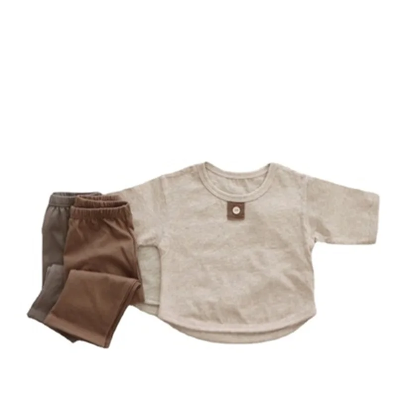 Children's clothing 2021 autumn children's simple small buttons home service suit boys and girls two-piece suit
Children's clothing 2021 autumn children's simple small buttons home service suit boys and girls two-piece suit