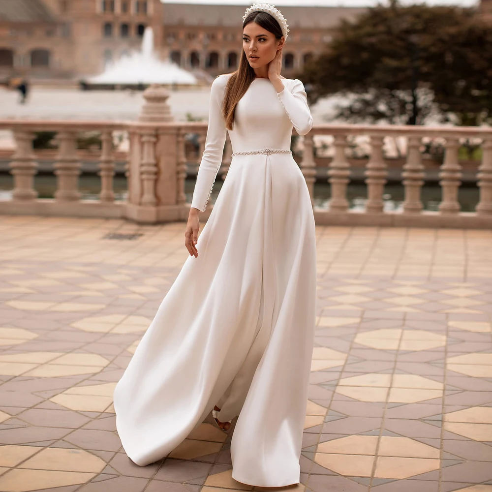 Vestidos Элегантные Свадебные платья Джерси Ленты складки вырез лодочкой длинный рукав; Со скрытыми пуговицами; А-силуэт свадебные платья
Vestidos Элегантные Свадебные платья Джерси Ленты складки вырез лодочкой длинный рукав; Со скрытыми пуговицами; А-силуэт свадебные платья