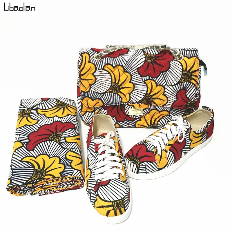 Fashion beautiful women wax Handbag with match sneaker shoes set made by flower african ankara prints fabric high quality 8-27
Fashion beautiful women wax Handbag with match sneaker shoes set made by flower african ankara prints fabric high quality 8-27