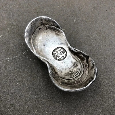 Ancient Chinese coins, ingots and silver ornaments 
Ancient Chinese coins, ingots and silver ornaments