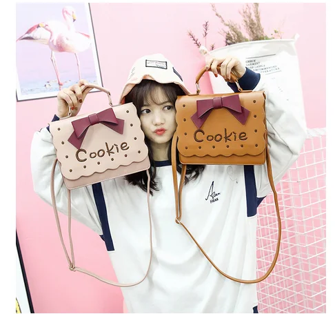 Маленькая сумка через плечо Sweet Lolita с вышивкой печенья, Женская милая сумка в стиле Харадзюку с бантом, сумка через плечо, розовая + коричнева...
Маленькая сумка через плечо Sweet Lolita с вышивкой печенья, Женская милая сумка в стиле Харадзюку с бантом, сумка через плечо, розовая + коричнева...