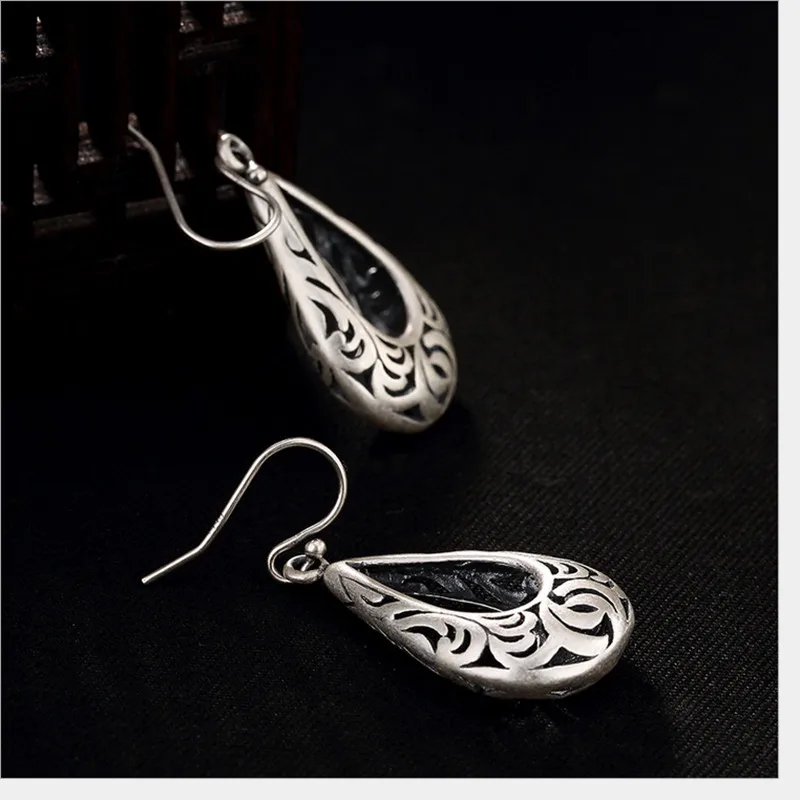 Real 999 Fine Silver Women Nepal Exotic Jewelry Handmade Hollow Totem Patterns Dangle Earrings Waterdrop Brincos Bijoux
Real 999 Fine Silver Women Nepal Exotic Jewelry Handmade Hollow Totem Patterns Dangle Earrings Waterdrop Brincos Bijoux