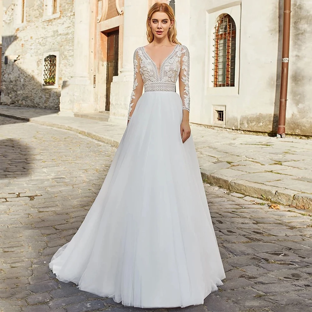 Elegant Wedding Dresses V Neck Long Sleeve Lace Appliques Tulle A Line Backless Sweep Train Beach Bridal Gowns Robe De Mariée
Elegant Wedding Dresses V Neck Long Sleeve Lace Appliques Tulle A Line Backless Sweep Train Beach Bridal Gowns Robe De Mariée