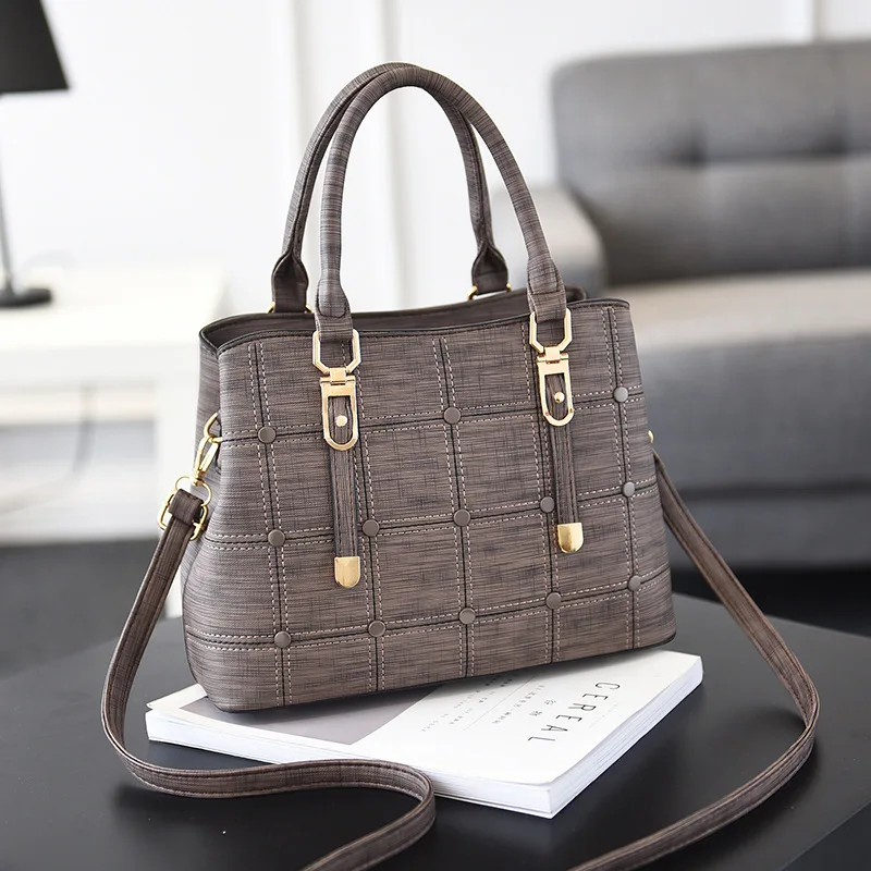Bag women's spring and summer new Pu Korean button decorated check luxury handbags women designer
Bag women's spring and summer new Pu Korean button decorated check luxury handbags women designer