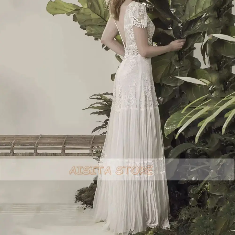Bohemian A Line Weddding Dresses 2021 Elegant Lace Appliques O Neck Backless Sequined Short Sleeve Tulle Sweep Train Bridal Gown
Bohemian A Line Weddding Dresses 2021 Elegant Lace Appliques O Neck Backless Sequined Short Sleeve Tulle Sweep Train Bridal Gown