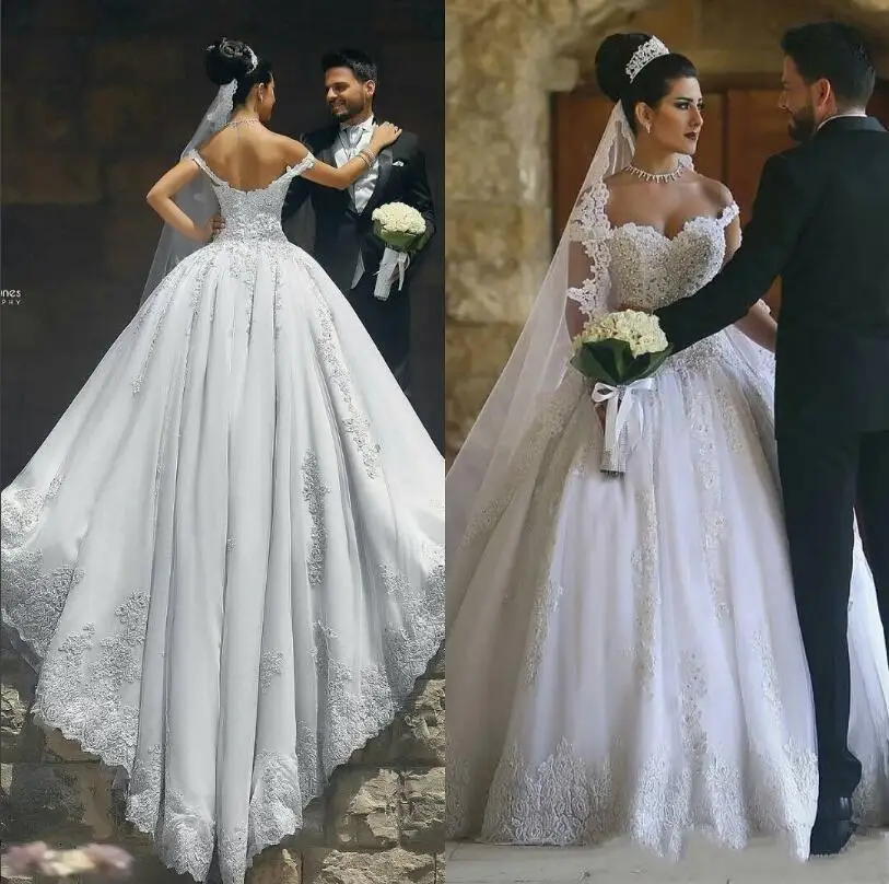 Saudi Arabia Ball Gown Wedding Dresses Cap Sleeves Lace Appliques Crystal Beaded Plus Size Sweep Train Button Back Formal Bridal
Saudi Arabia Ball Gown Wedding Dresses Cap Sleeves Lace Appliques Crystal Beaded Plus Size Sweep Train Button Back Formal Bridal