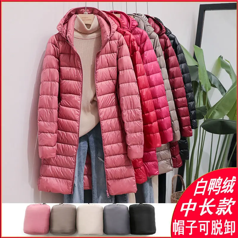 Autumn and winter new lightweight down jacket women's medium long solid color hooded light thin coat large size detachable hat
Autumn and winter new lightweight down jacket women's medium long solid color hooded light thin coat large size detachable hat