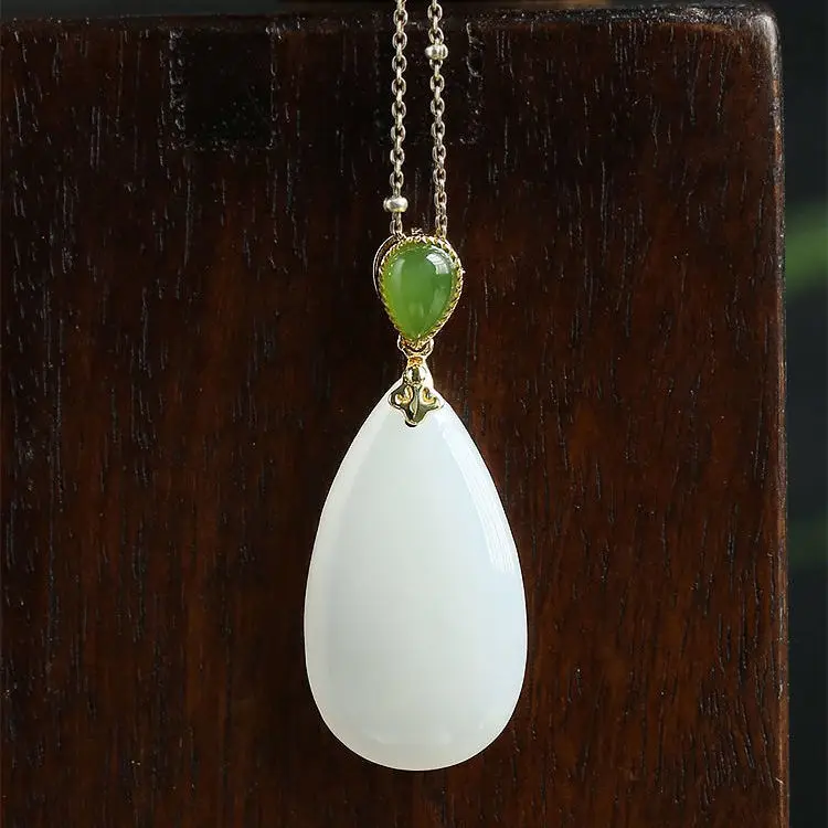 Designer's unique creative natural Hetian white jade drop-shaped pendant necklace temperament exquisite elegant charm jewelry
Designer's unique creative natural Hetian white jade drop-shaped pendant necklace temperament exquisite elegant charm jewelry