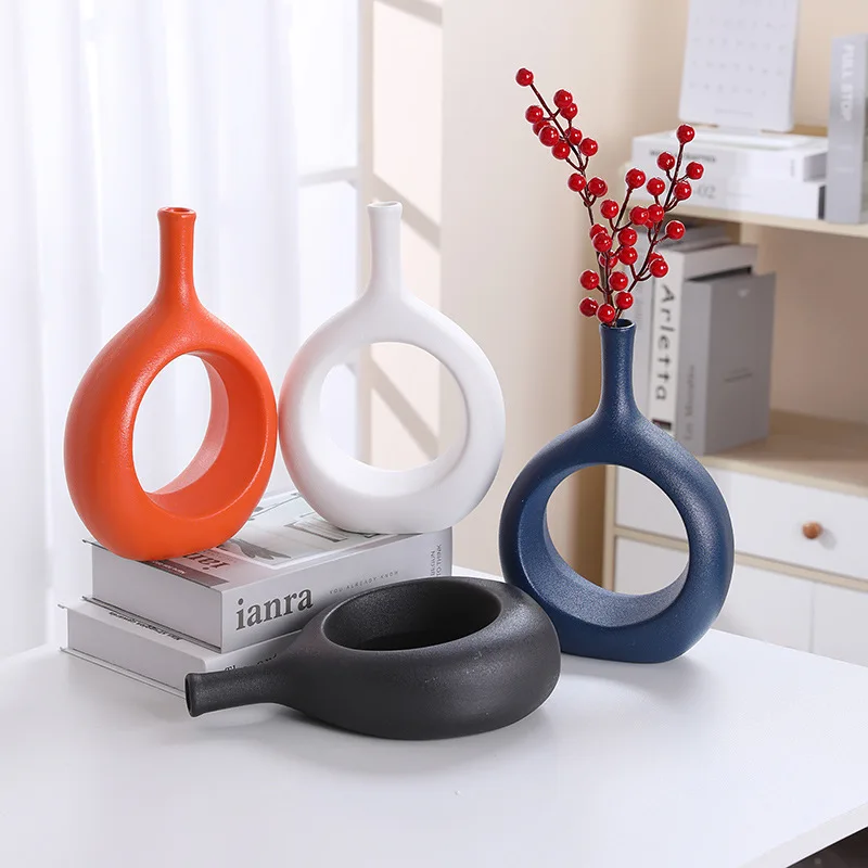 White round hollow ceramic vase dining table living room decoration home decoration flower arrangement ceramic vase home decor
White round hollow ceramic vase dining table living room decoration home decoration flower arrangement ceramic vase home decor