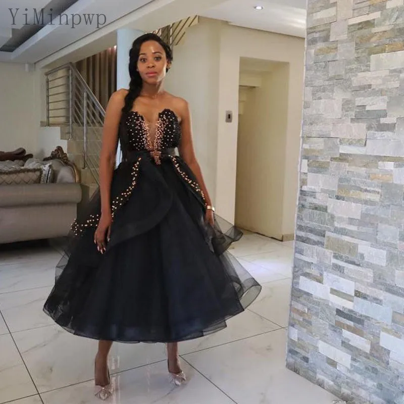 YiMinpwp Black Prom Dresses Sweet Heart Backless Tea Length A Line Pearls Beads Appliques Formal Women Evening Gowns Plus Size
YiMinpwp Black Prom Dresses Sweet Heart Backless Tea Length A Line Pearls Beads Appliques Formal Women Evening Gowns Plus Size