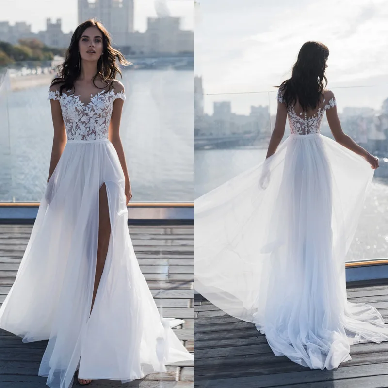 Sexy Lace Wedding Dress V Neck Backless Cap Sleeve Split Tulle Appliques Elegant Simple A-line Floor Length Beach Wedding Dress
Sexy Lace Wedding Dress V Neck Backless Cap Sleeve Split Tulle Appliques Elegant Simple A-line Floor Length Beach Wedding Dress