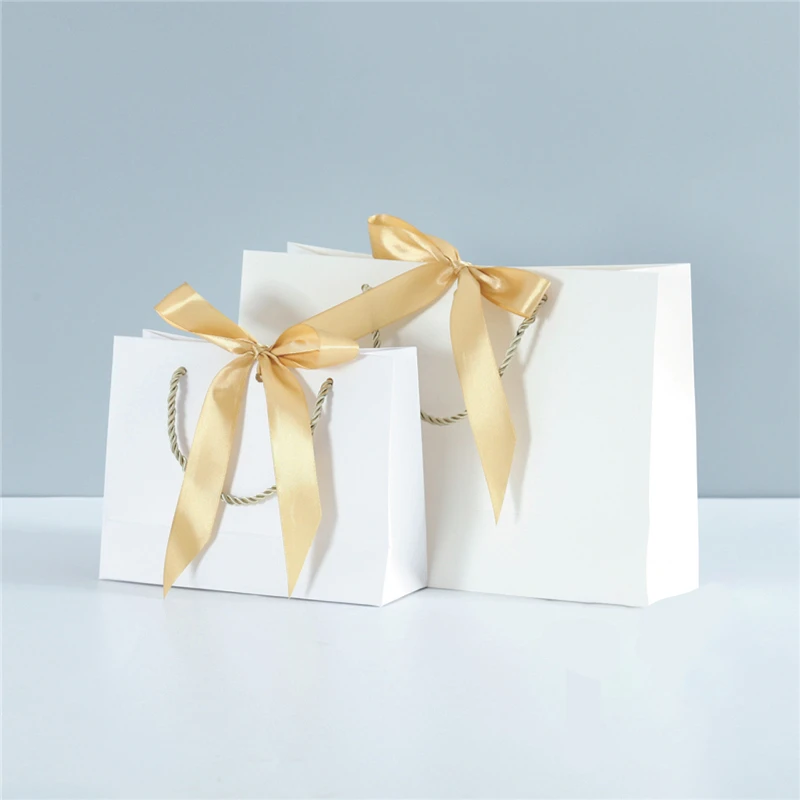 10PC Bowknot Gift Bag Box Present Paper Bag with Ribbon for Clothes Shoes Shopping Storage Handbag Wedding Birthday Wrapping Box
10PC Bowknot Gift Bag Box Present Paper Bag with Ribbon for Clothes Shoes Shopping Storage Handbag Wedding Birthday Wrapping Box