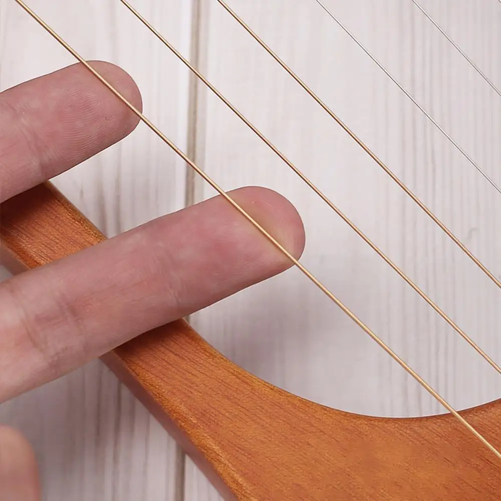 Solid Wooden 7-String Lyre Harp Stringed Instruments 7 Strings English Manual Liqin with Tuning Wrench
Solid Wooden 7-String Lyre Harp Stringed Instruments 7 Strings English Manual Liqin with Tuning Wrench