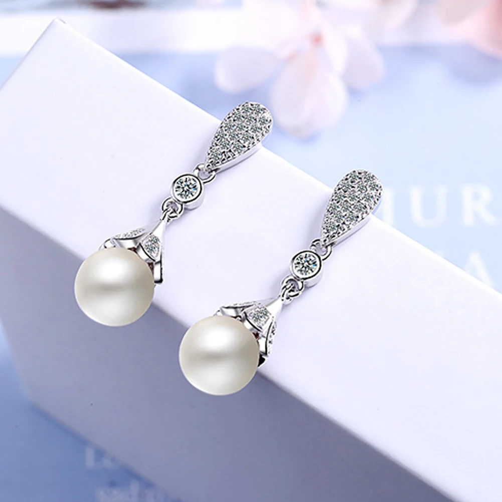 Elegant Round Imitation Pearl Dangle Earrings Dazzling CZ Women Engagement Wedding Graceful Accessories Fashion Earrings
Elegant Round Imitation Pearl Dangle Earrings Dazzling CZ Women Engagement Wedding Graceful Accessories Fashion Earrings