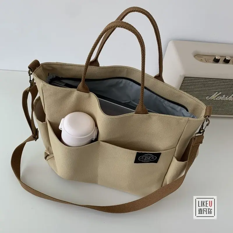 Japanese Style Multi-Pocket Tote Canvas Bag Simple All -Matching Large Capacity Shoulder Portable Messenger Bag for Women
Japanese Style Multi-Pocket Tote Canvas Bag Simple All -Matching Large Capacity Shoulder Portable Messenger Bag for Women