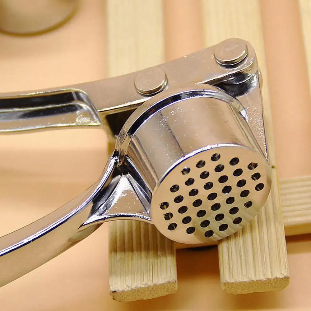Zinc Alloyl Garlic Press Crusher Kitchen Cooking Vegetables Ginger Squeezer Masher Handheld Ginger Mincer Tools Garlic Masher
Zinc Alloyl Garlic Press Crusher Kitchen Cooking Vegetables Ginger Squeezer Masher Handheld Ginger Mincer Tools Garlic Masher