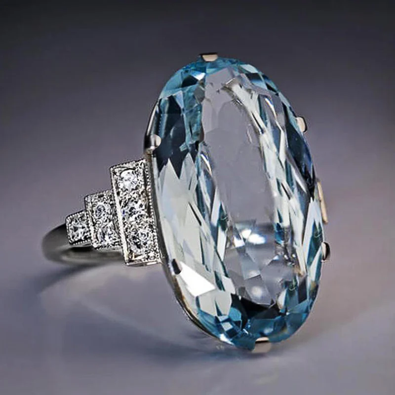 Фото Женское светло-голубое обручальное кольцо с овальным камнем | Украшения и