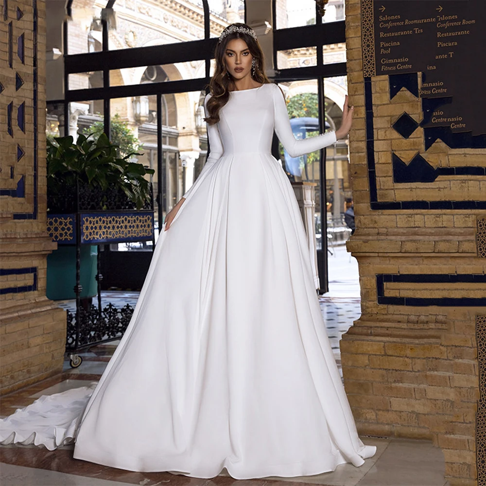 Elegant Satin Wedding Dresses Robe De Marie 2021 Simple Long Sleeves O Neck Muslim Chapel Train A-Line Bridal Gowns
Elegant Satin Wedding Dresses Robe De Marie 2021 Simple Long Sleeves O Neck Muslim Chapel Train A-Line Bridal Gowns