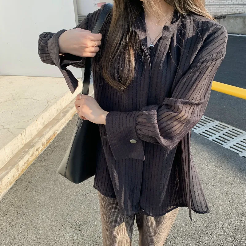 2021 spring and summer Korean style loose shirt women's cross waist striped chiffon temperament fashion top 
2021 spring and summer Korean style loose shirt women's cross waist striped chiffon temperament fashion top