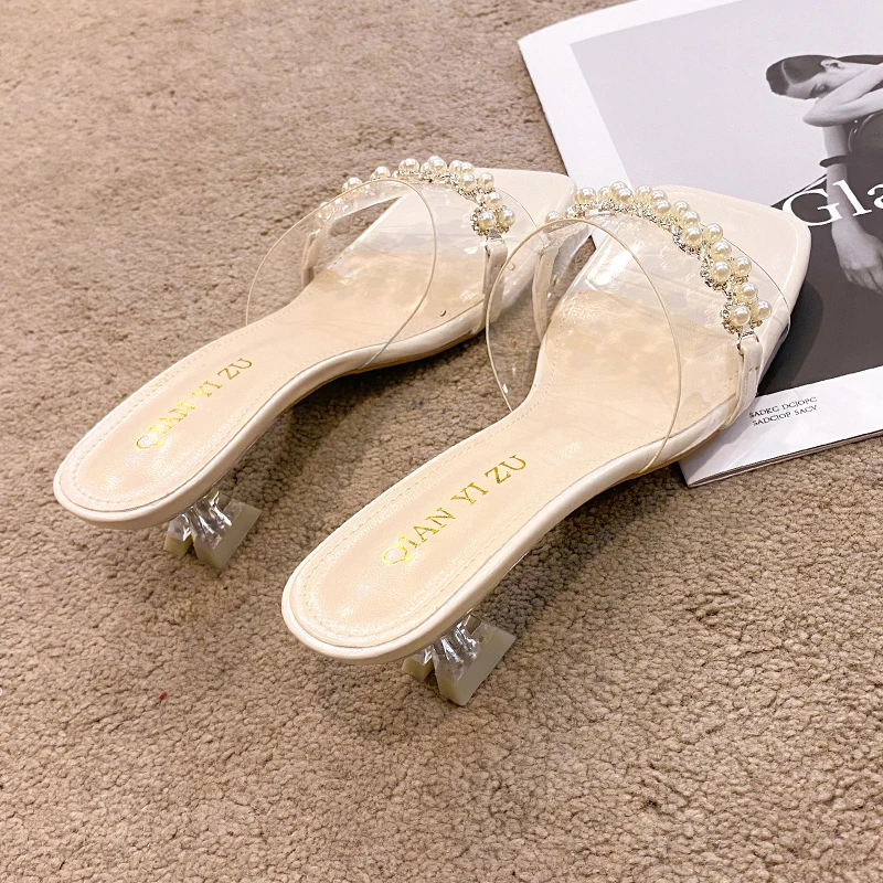 2021 summer new fairy style temperament pearl word belt sandals female crystal with transparent sandals ins slippers tide
2021 summer new fairy style temperament pearl word belt sandals female crystal with transparent sandals ins slippers tide