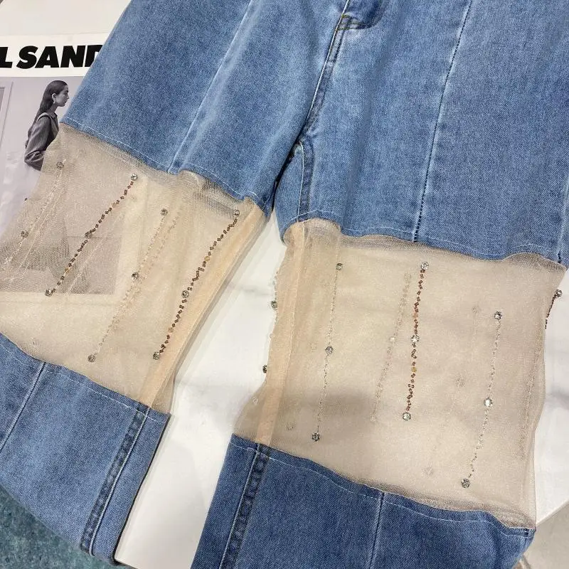 2021 Summer New Mesh Hollow Out Stitching Long Denim Pants Rhinestone Design Split Wide Leg Jeans Women Baggy Jeans Trousers
2021 Summer New Mesh Hollow Out Stitching Long Denim Pants Rhinestone Design Split Wide Leg Jeans Women Baggy Jeans Trousers